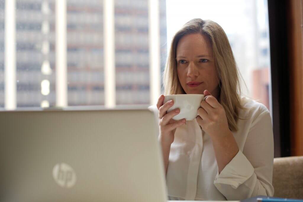 Lisa Mahar Office Location Holding Teacup